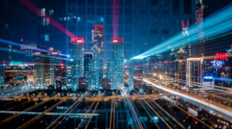 Light trails above buildings at night in China.